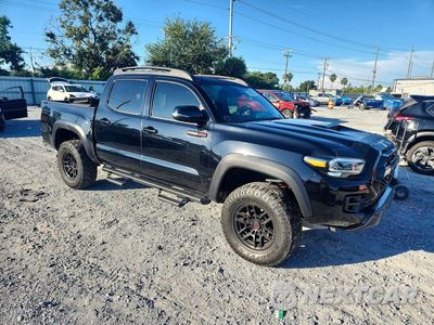 Czwarte zdjęcie samochodu z boku: 2021 TOYOTA TACOMA TRD PRO VIN:5TFCZ5AN9MX264891 - miniatura