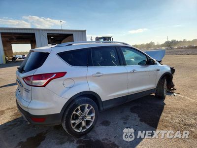 Trzecie zdjęcie samochodu z tyłu: 2016 FORD ESCAPE TITANIUM VIN:1FMCU0JX0GUC85794 - miniatura