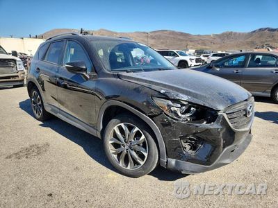Czwarte zdjęcie samochodu z boku: 2016 MAZDA CX-5 GT VIN:JM3KE4DY0G0749951 - miniatura