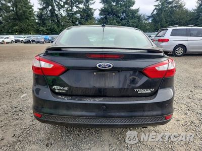 Zdjęcie 6 z 12 samochodu: 2013 FORD FOCUS TITANIUM VIN:1FADP3J23DL249675 - miniatura