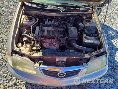 Zdjęcie 11 z 12 samochodu: 2002 MAZDA 626 LX VIN:1YVGF22C025302565 - miniatura