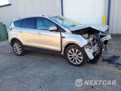 Czwarte zdjęcie samochodu z boku: 2017 FORD ESCAPE TITANIUM VIN:1FMCU9J97HUE25816 - miniatura