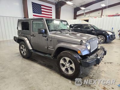 Czwarte zdjęcie samochodu z boku: 2016 JEEP WRANGLER SAHARA VIN:1C4AJWBG4GL203559 - miniatura