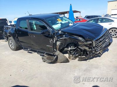 Czwarte zdjęcie samochodu z boku: 2021 GMC CANYON AT4 VIN:1GTG6FEN0M1100068 - miniatura