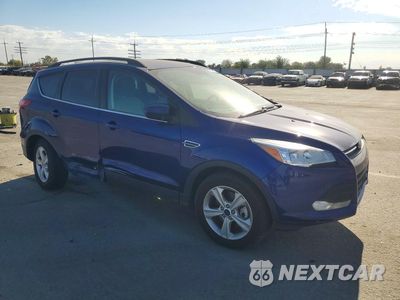 Czwarte zdjęcie samochodu z boku: 2016 FORD ESCAPE SE VIN:1FMCU9GX4GUC79699 - miniatura