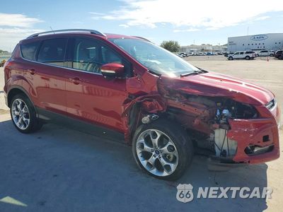 Czwarte zdjęcie samochodu z boku: 2014 FORD ESCAPE TITANIUM VIN:1FMCU0J90EUC07627 - miniatura