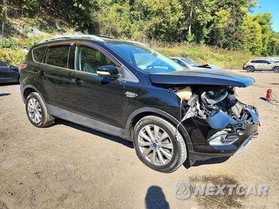 Czwarte zdjęcie samochodu z boku: 2017 FORD ESCAPE TITANIUM VIN:1FMCU9J98HUA07135 - miniatura