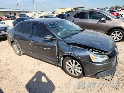 Czwarte zdjęcie samochodu z boku: 2012 VOLKSWAGEN JETTA SE VIN:3VWDX7AJ2CM356350 - miniatura