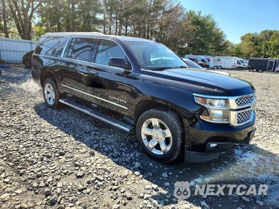 Czwarte zdjęcie samochodu z boku: 2018 CHEVROLET SUBURBAN VIN:1GNSKHKCXJR315238 - miniatura