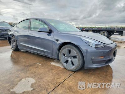 Czwarte zdjęcie samochodu z boku: 2023 TESLA MODEL 3 VIN:5YJ3E1EA0PF457229 - miniatura