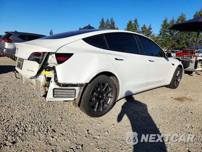 Trzecie zdjęcie samochodu z tyłu: 2023 TESLA MODEL 3 VIN:5YJ3E1EB3PF393535 - miniatura