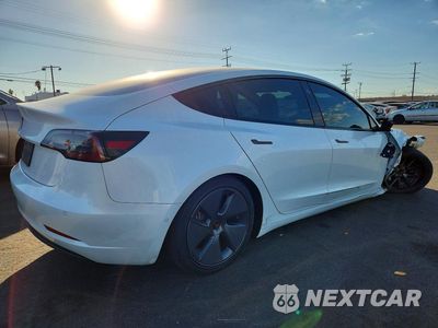 Trzecie zdjęcie samochodu z tyłu: 2022 TESLA MODEL 3 VIN:5YJ3E1EA2NF111731 - miniatura