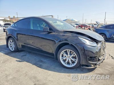Czwarte zdjęcie samochodu z boku: 2023 TESLA MODEL Y VIN:7SAYGDEE8PA113880 - miniatura