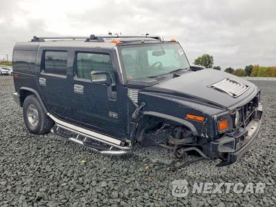Czwarte zdjęcie samochodu z boku: 2003 HUMMER H2 VIN:5GRGN23U63H117788 - miniatura