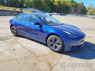 Czwarte zdjęcie samochodu z boku: 2023 TESLA MODEL 3 VIN:5YJ3E1EA1PF699186 - miniatura