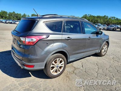 Trzecie zdjęcie samochodu z tyłu: 2018 FORD ESCAPE SEL VIN:1FMCU9HD1JUA98975 - miniatura
