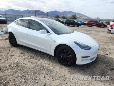 Czwarte zdjęcie samochodu z boku: 2019 TESLA MODEL 3 VIN:5YJ3E1EB7KF454684 - miniatura