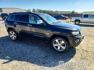 Czwarte zdjęcie samochodu z boku: 2014 JEEP GRAND CHEROKEE OVERLAND VIN:1C4RJFCT4EC125263 - miniatura