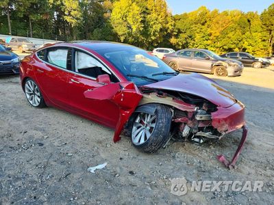 Czwarte zdjęcie samochodu z boku: 2019 TESLA MODEL 3 VIN:5YJ3E1EB8KF236642 - miniatura