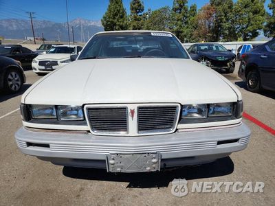 Piąte zdjęcie samochodu w środku: 1987 PONTIAC GRAND AM LE VIN:1G2NV14U6HC939419 - miniatura