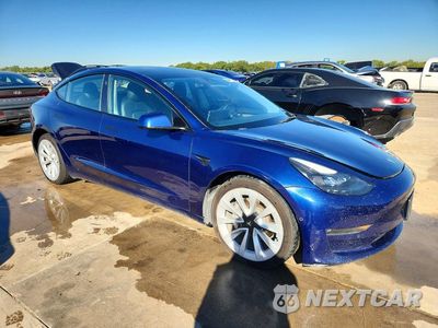 Czwarte zdjęcie samochodu z boku: 2022 TESLA MODEL 3 VIN:5YJ3E1EA4NF287356 - miniatura