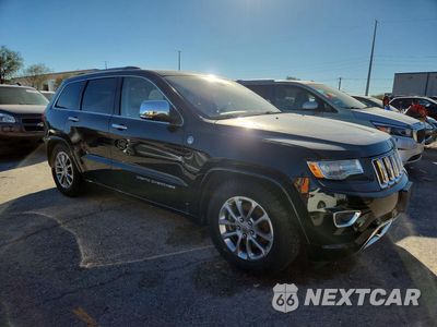Czwarte zdjęcie samochodu z boku: 2015 JEEP GRAND CHEROKEE OVERLAND VIN:1C4RJFCMXFC176017 - miniatura