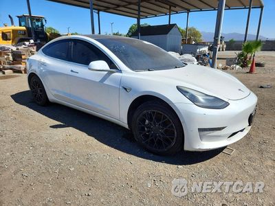 Czwarte zdjęcie samochodu z boku: 2019 TESLA MODEL 3 VIN:5YJ3E1EA5KF482474 - miniatura