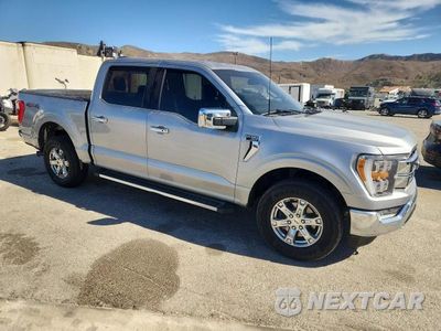 Czwarte zdjęcie samochodu z boku: 2021 FORD F150 SUPERCREW VIN:1FTFW1E87MKE57248 - miniatura