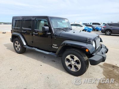 Czwarte zdjęcie samochodu z boku: 2016 JEEP WRANGLER UNLIMITED SAHARA VIN:1C4BJWEGXGL114479 - miniatura