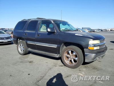 Czwarte zdjęcie samochodu z boku: 2004 CHEVROLET TAHOE C1500 VIN:1GNEC13V14R121798 - miniatura