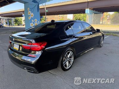 Czwarte zdjęcie samochodu z boku: 2019 BMW 750 XI VIN:WBA7F2C56K8240643 - miniatura