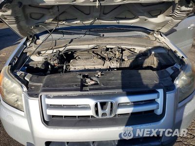 Zdjęcie 12 z 13 samochodu: 2007 HONDA PILOT EXL VIN:2HKYF18697H514099 - miniatura