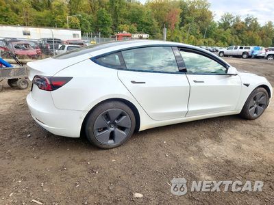 Trzecie zdjęcie samochodu z tyłu: 2021 TESLA MODEL 3 VIN:5YJ3E1EA2MF047057 - miniatura
