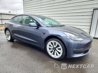Czwarte zdjęcie samochodu z boku: 2023 TESLA MODEL 3 VIN:5YJ3E1EA5PF447134 - miniatura