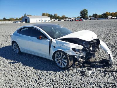 Czwarte zdjęcie samochodu z boku: 2019 TESLA MODEL 3 VIN:5YJ3E1EA6KF412921 - miniatura