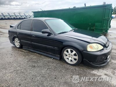 Czwarte zdjęcie samochodu z boku: 2000 HONDA CIVIC LX VIN:1HGEJ6676YL014152 - miniatura