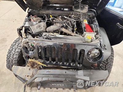 Zdjęcie 12 z 13 samochodu: 2010 JEEP WRANGLER UNLIMITED SAHARA VIN:1J4BA5H11AL147633 - miniatura