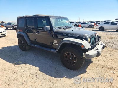 Czwarte zdjęcie samochodu z boku: 2011 JEEP WRANGLER UNLIMITED RUBICON VIN:1J4HA6H12BL630310 - miniatura