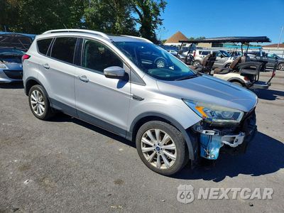 Czwarte zdjęcie samochodu z boku: 2017 FORD ESCAPE TITANIUM VIN:1FMCU9J98HUD90574 - miniatura