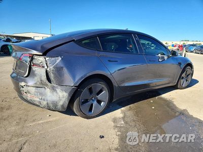 Trzecie zdjęcie samochodu z tyłu: 2023 TESLA MODEL 3 VIN:5YJ3E1EB3PF670538 - miniatura