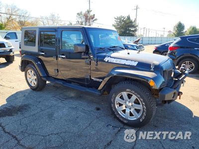Czwarte zdjęcie samochodu z boku: 2009 JEEP WRANGLER UNLIMITED SAHARA VIN:1J4GA59169L721157 - miniatura