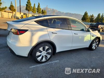 Trzecie zdjęcie samochodu z tyłu: 2021 TESLA MODEL Y VIN:5YJYGAEE0MF179947 - miniatura