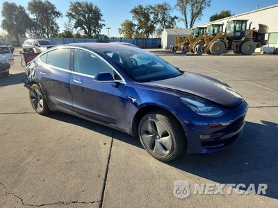 Czwarte zdjęcie samochodu z boku: 2018 TESLA MODEL 3 VIN:5YJ3E1EA8JF022854 - miniatura