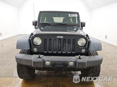 Piąte zdjęcie samochodu w środku: 2015 JEEP WRANGLER UNLIMITED SPORT VIN:1C4BJWDG0FL524210 - miniatura