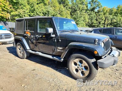 Czwarte zdjęcie samochodu z boku: 2014 JEEP WRANGLER UNLIMITED SAHARA VIN:1C4BJWEG1EL138487 - miniatura