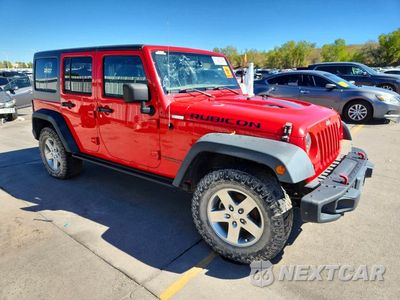 Czwarte zdjęcie samochodu z boku: 2015 JEEP WRANGLER UNLIMITED RUBICON VIN:1C4BJWFG7FL591044 - miniatura