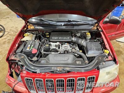 Zdjęcie 12 z 13 samochodu: 2003 JEEP GRAND CHEROKEE OVERLAND VIN:1J8GW68J53C573131 - miniatura