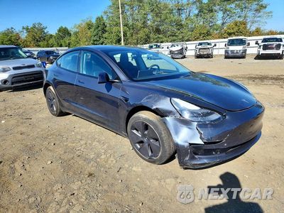 Czwarte zdjęcie samochodu z boku: 2022 TESLA MODEL 3 VIN:5YJ3E1EA9NF343887 - miniatura