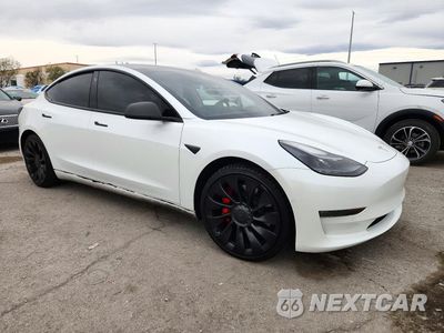 Czwarte zdjęcie samochodu z boku: 2022 TESLA MODEL 3 VIN:5YJ3E1EC6NF339734 - miniatura