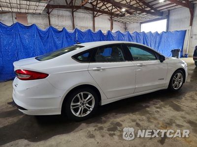 Trzecie zdjęcie samochodu z tyłu: 2018 FORD FUSION SE HYBRID VIN:3FA6P0LU9JR141404 - miniatura